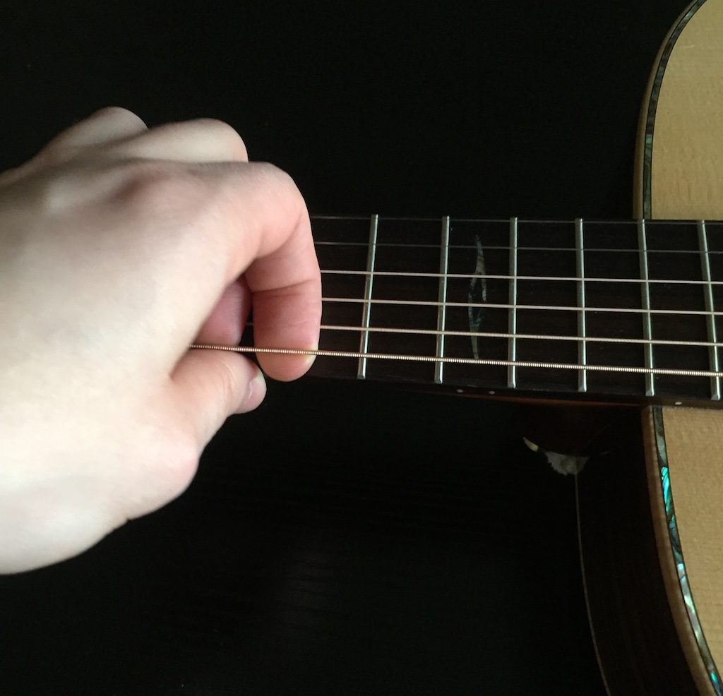 stretching guitar strings
